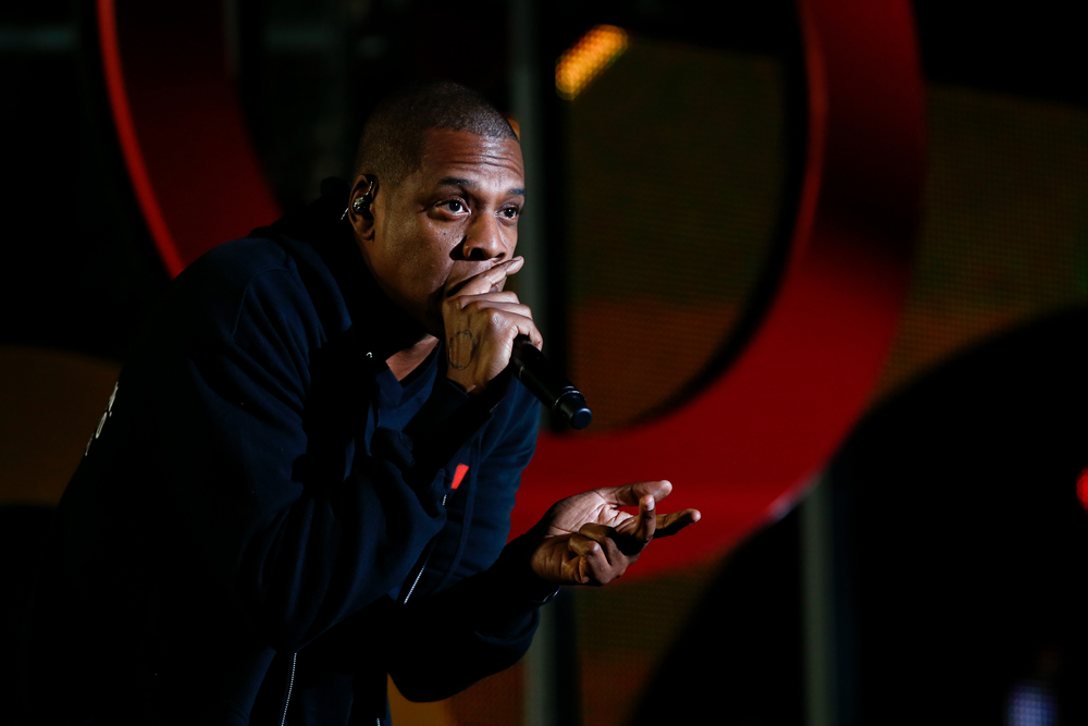 Jay Z oftens use hand gesture, which is similar to the sign of the horns associated with heavy metal music