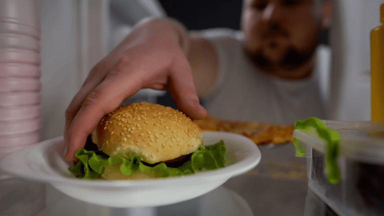 a man take the hamburger from fridge